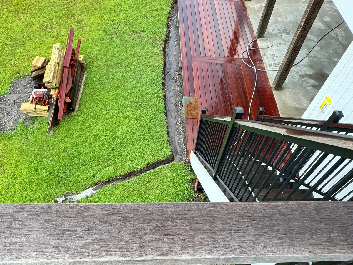 Deck stairs and landing part way through a low-pressure wash in Jacksonville NC